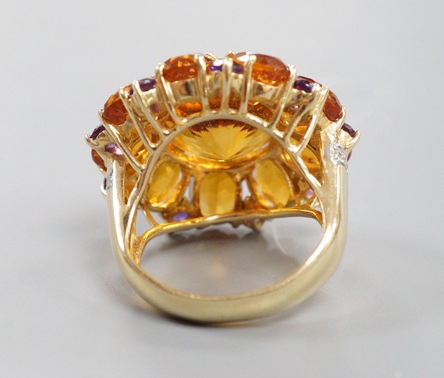 A large 14k, citrine and amethyst cluster set flower head dress ring, with diamond chip set shoulders, size H, gross weight 11.4 grams.